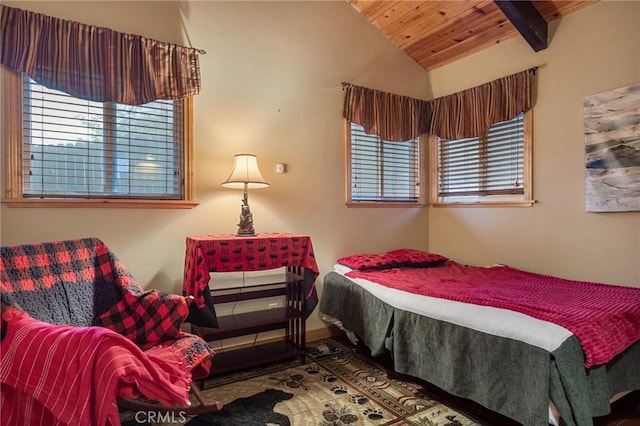 bedroom with lofted ceiling with beams and wooden ceiling