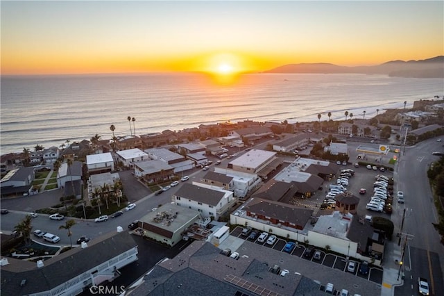 aerial view at dusk with a water view