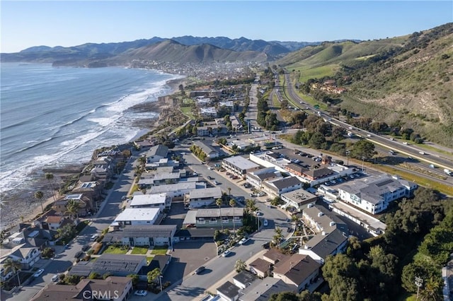 bird's eye view with a water and mountain view