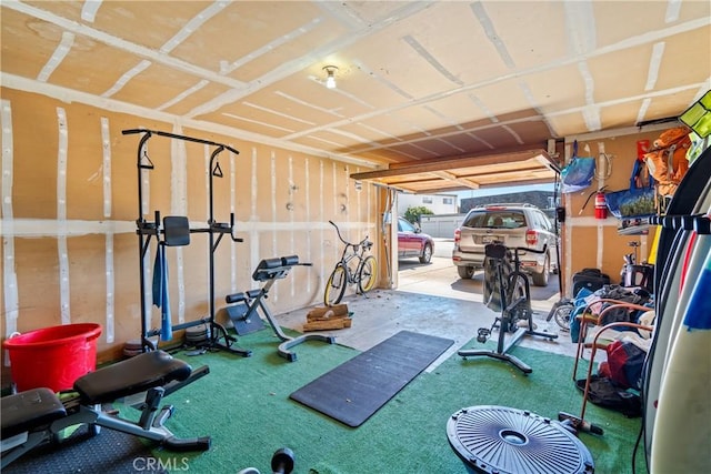 exercise room with a garage