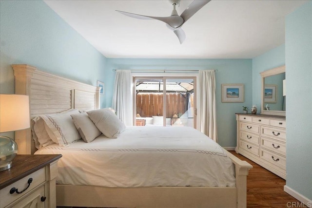 bedroom featuring dark wood-style floors, access to outside, baseboards, and ceiling fan