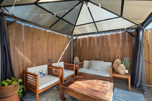 view of patio / terrace featuring fence and an outdoor hangout area