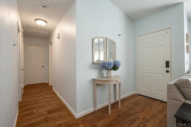 entrance foyer with wood finished floors and baseboards