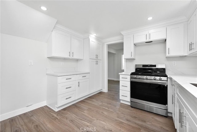 kitchen featuring white cabinetry, light wood-style flooring, and stainless steel gas range
