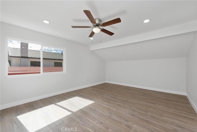 bonus room with wood finished floors, baseboards, recessed lighting, ceiling fan, and vaulted ceiling