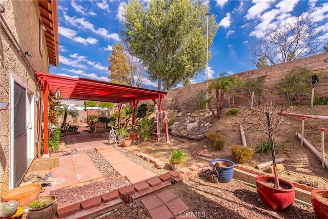 view of patio featuring a pergola and a fenced backyard