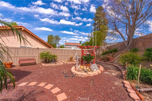 view of yard with a fenced backyard