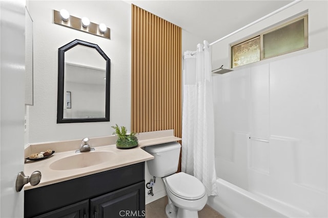 bathroom featuring toilet, shower / bath combo with shower curtain, and vanity