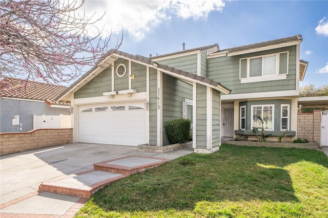 view of front of home featuring a garage, driveway, a front lawn, and fence