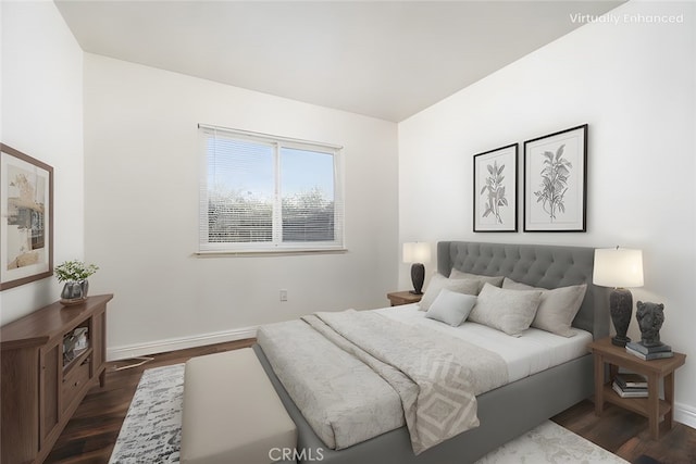 bedroom featuring dark wood-style floors and baseboards