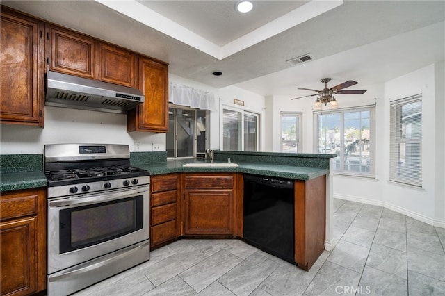 kitchen featuring stainless steel gas stove, black dishwasher, visible vents, under cabinet range hood, and a sink