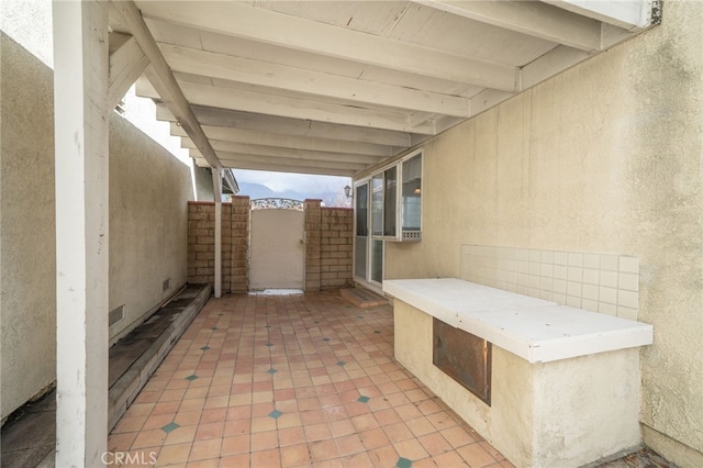 view of patio featuring a gate and visible vents