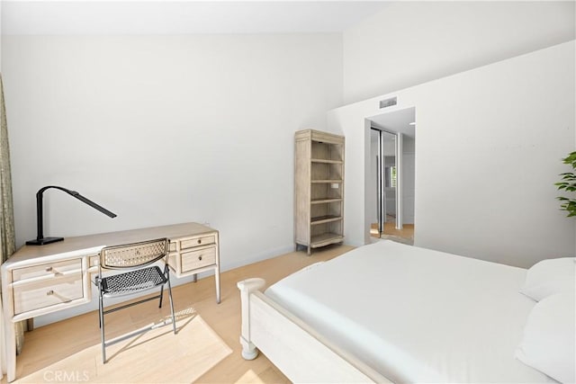 bedroom featuring visible vents and light wood-style floors