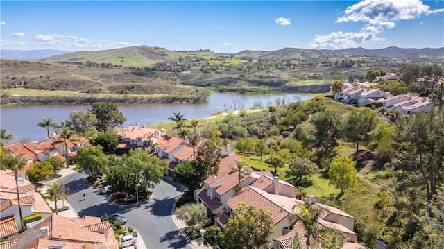 birds eye view of property with a residential view and a water and mountain view