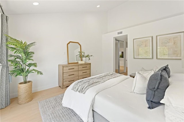 6 Baristo Unit 39, Irvine, CA 92612 - bedroom featuring recessed lighting, light wood-type flooring, baseboards, and lofted ceiling