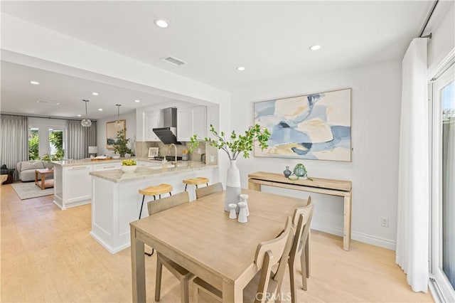 6 Baristo Unit 39, Irvine, CA 92612 - dining area with light wood finished floors, recessed lighting, and baseboards