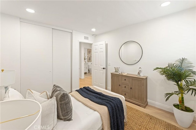 6 Baristo Unit 39, Irvine, CA 92612 - bedroom featuring light wood-type flooring, baseboards, recessed lighting, and a closet