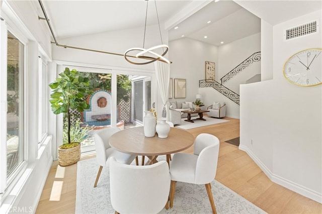 6 Baristo Unit 39, Irvine, CA 92612 - dining area featuring vaulted ceiling, light wood finished floors, a chandelier, recessed lighting, and baseboards