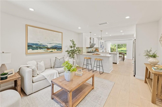 6 Baristo Unit 39, Irvine, CA 92612 - living area featuring recessed lighting and light wood-type flooring