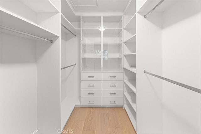 6 Baristo Unit 39, Irvine, CA 92612 - spacious closet with light wood-style floors
