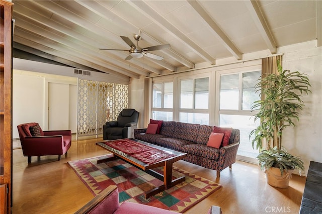 living room with a ceiling fan, a healthy amount of sunlight, visible vents, and lofted ceiling with beams