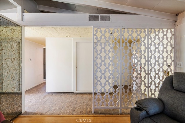 interior space featuring visible vents and wood finished floors