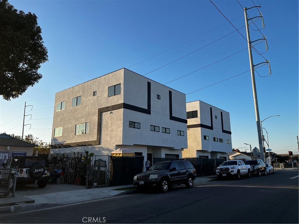 view of building exterior with fence