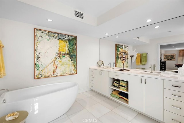 full bathroom with double vanity, a sink, visible vents, and recessed lighting