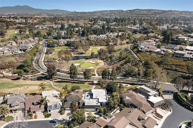 birds eye view of property featuring view of golf course and a residential view