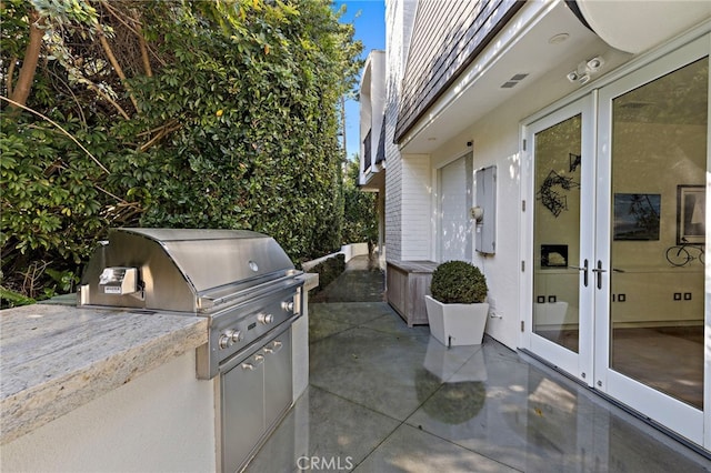 view of patio / terrace featuring exterior kitchen and french doors