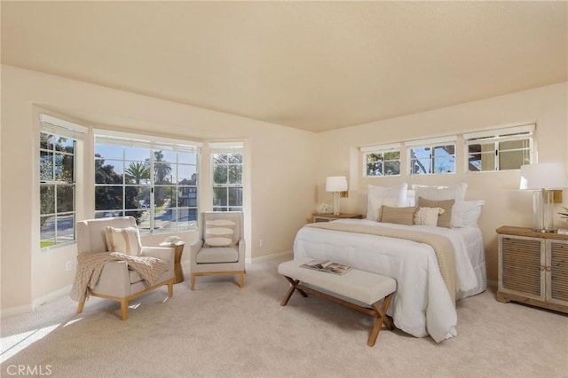 carpeted bedroom with baseboards