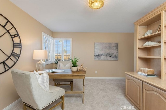 office featuring light colored carpet and baseboards