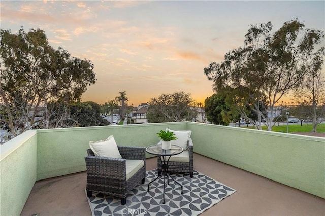 view of balcony at dusk