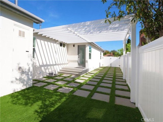 view of yard with entry steps, fence private yard, a gate, and visible vents