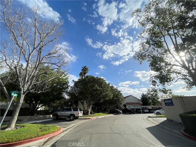 view of street with curbs