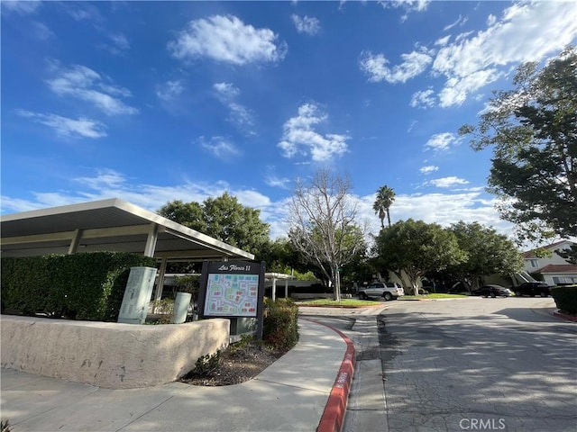 view of road with curbs and sidewalks