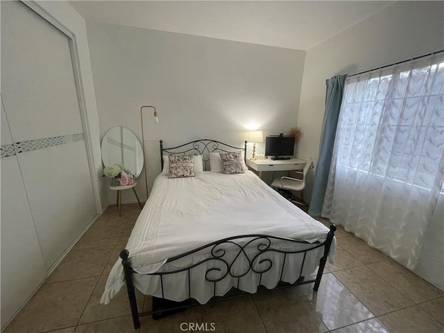 bedroom with tile patterned floors