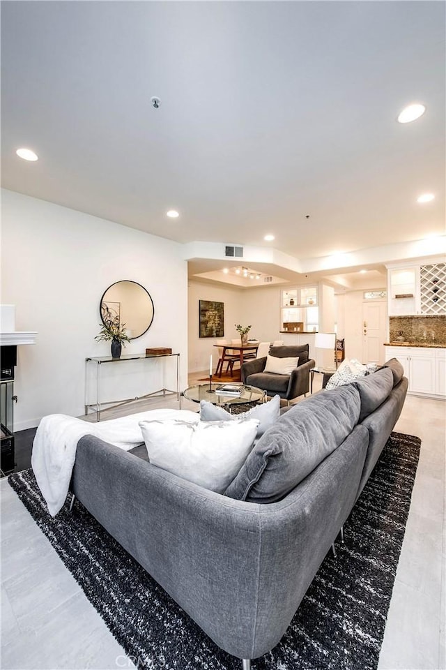 living room with visible vents and recessed lighting