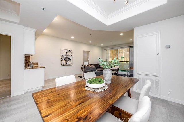 dining area featuring visible vents, baseboards, a tray ceiling, ornamental molding, and recessed lighting