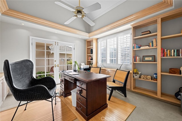 office space with a raised ceiling, crown molding, french doors, and ceiling fan