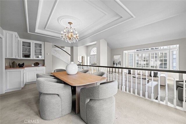 4 Huntington Ct, Newport Beach, CA 92660 - dining space with a tray ceiling, light carpet, plenty of natural light, and a chandelier