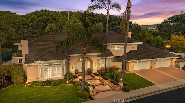4 Huntington Ct, Newport Beach, CA 92660 - view of front facade with stucco siding, driveway, an attached garage, a lawn, and a chimney