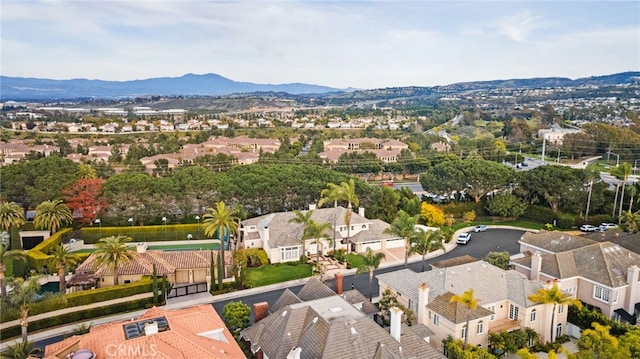 birds eye view of property with a mountain view and a residential view