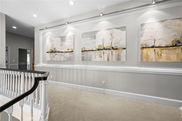 hallway with an upstairs landing, carpet flooring, recessed lighting, and baseboards