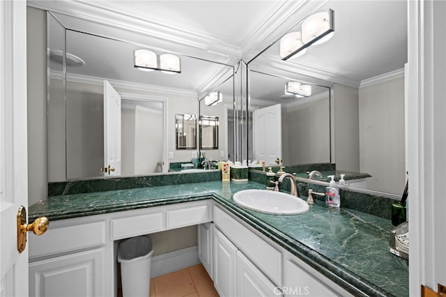 bathroom featuring tile patterned flooring, crown molding, and vanity