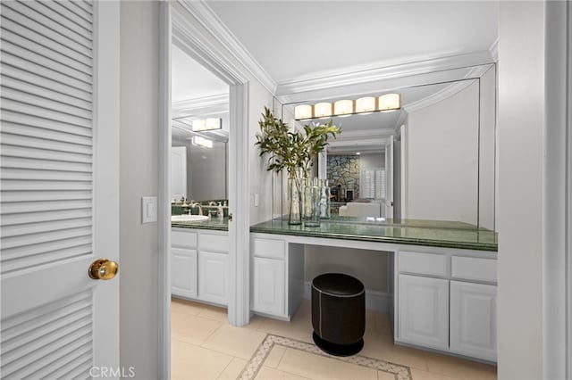 bar featuring ornamental molding, light tile patterned flooring, and a sink