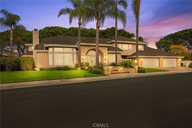 4 Huntington Ct, Newport Beach, CA 92660 - view of front of property featuring a chimney, stucco siding, driveway, a yard, and a garage