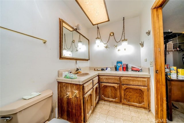 bathroom featuring vanity, toilet, and tile patterned floors