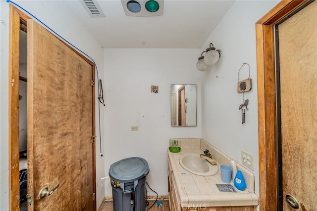 bathroom with visible vents and vanity