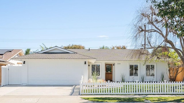 single story home featuring a shingled roof, concrete driveway, a fenced front yard, an attached garage, and stucco siding